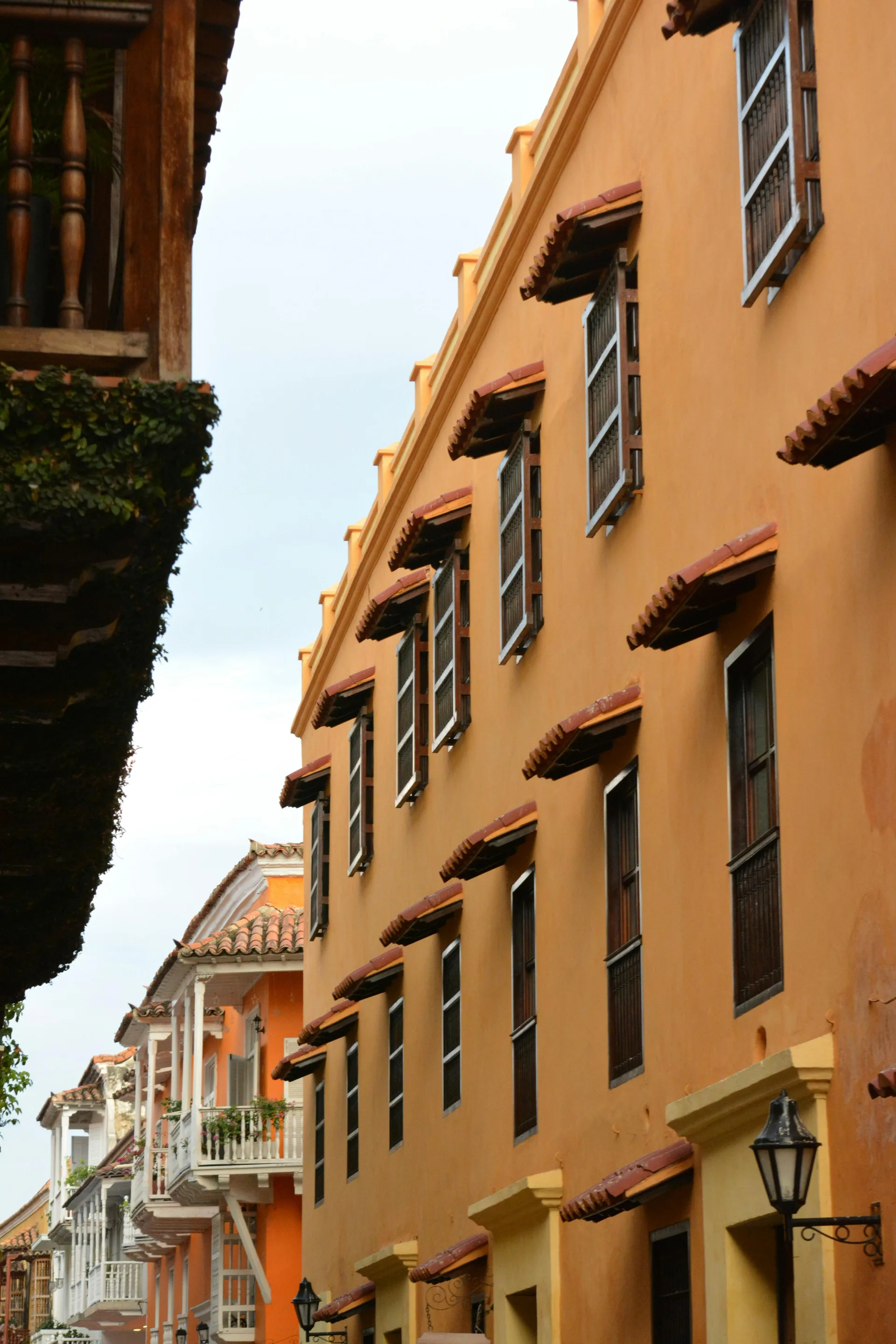 Understanding Colombia’s Estrato System — A vibrant view of colonial architecture with colorful facades and open windows o