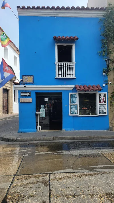 Vibrant blue cafe showcasing colonial style architecture in Cartagena, Colombia.