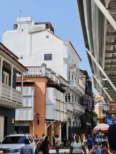 Bustling street in Cartagena, highlighting colonial architecture and lively city atmosphere.