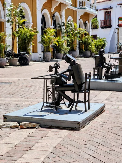 Captivating metal sculptures in a historic square in Cartagena, Colombia, depicting abstract figures in an artistic style.