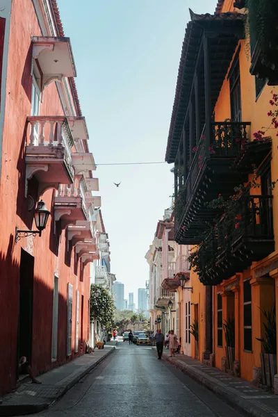 Explore the colorful streets of Cartagena, Colombia, showcasing vibrant colonial architecture and serene urban life.